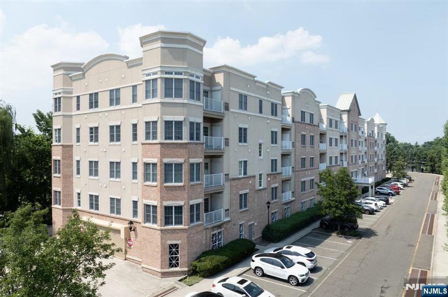 Beautiful and sun-filled luxury condo overlooking serene golf course and park views, offering breathtaking scenery through all four seasonsâ€”lush greenery in spring and summer, vibrant colors in fall, and peaceful snow-covered landscapes in winter. This spacious 2-bedroom, 2-bath residence features hardwood floors throughout, an open-concept living and dining area, and large windows that bring in abundant natural light while framing the stunning outdoor views. The primary suite offers a private retreat with an en-suite bath and generous closet space. Enjoy in-unit washer and dryer, one indoor garage parking space, and ample guest parking. The community offers a well-maintained clubhouse and common areas, providing a quiet and refined living environment. Conveniently located near major highways, shopping, dining, and public transportation, while still offering privacy, tranquility, and picturesque surroundings. A rare opportunity to enjoy luxury living with year-round scenic views. *Please note that the current 2026 HOA fee reflects a temporary adjustment related to prior concrete construction work in the building's common areas, which has now been completed. Beginning in 2027, the HOA fee is expected to revert to the 2025 base amount, plus any applicable annual increase.