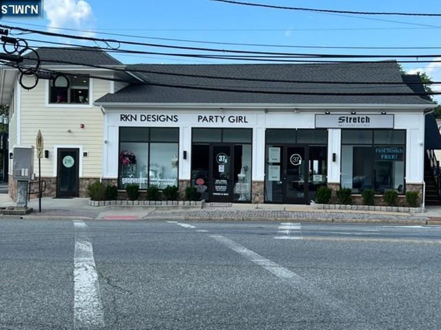 Modern building located on busy signalized corner. Plenty of on-site parking in large rear lot. All spaces have private entrances. *Opportunity for User/Buyer to Occupy space and collect rent from existing Tenant. All units are separately metered. Additional Income and Expense Information available on request.