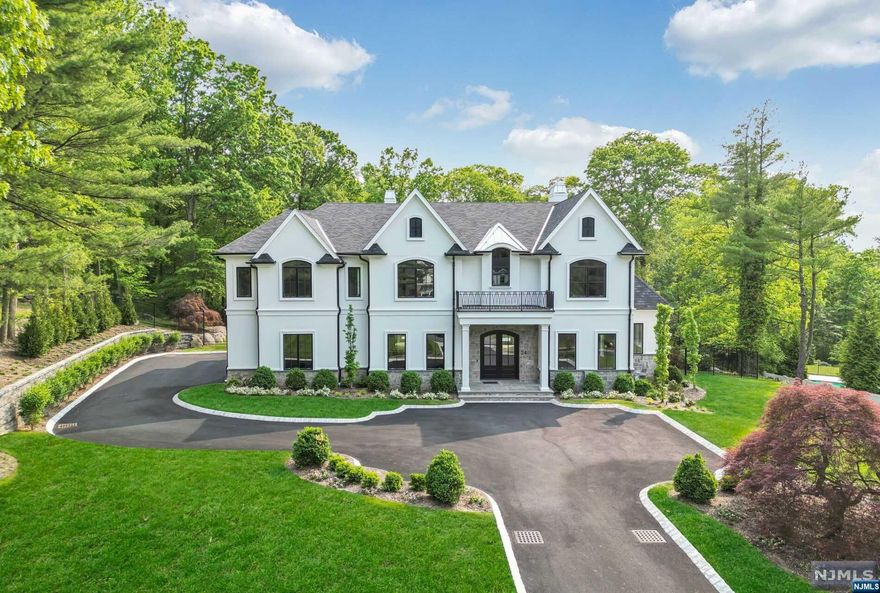 WELCOME TO THE EPITOME OF LUXURY LIVING! This brand new architectural masterpiece, nestled in the highly sought after Alpine, NJ, offers the perfect blend of style, comfort & sophistication. This exquisite home boasts sleek contemporary design, featuring clean lines, expansive windows, & high end finishes throughout. Experience the grand scale & showstopper 1st floor featuring over 1000 SF in the Bespoke Chef's MEIK & Great Room w/ 2 Wetbars & Fireplace. The space features a wall of windows & doors open to an oversized stone terrace, saltwater pool, spa & outdoor kitchen! Gorgeous heated garage opens to mudroom/cabana. Five ensuite bedrooms w/ WICS on 2nd, including STUNNING Owner's Suite! Finished LL w/ 2 staircases & bedroom suite. Experience the prestige that comes w/ residing in one of the country's most coveted neighborhoods, without sacrificing your financial freedom because of the low taxes. Embrace the modern luxury lifestyle in this exceptional home. Ranked #1 NJ School!