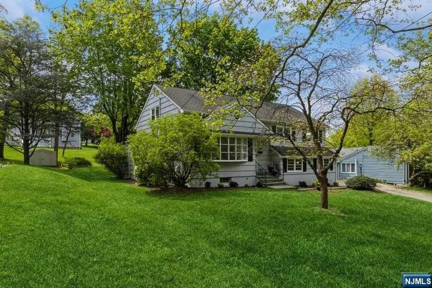 A MUST SEE! Fabulous location, sun filled gem in town! A lovely split in beautiful Broadlawn - in a sought after, tree lined Rumson Road, walking distance to highly rated schools, houses of worship, restaurants and shopping. Freshly painted exterior w/ white trim. Gorgeous lush yard with a great size deck for entertaining. Sun-filled with updates, and beautiful hardwood floors throughout, this warm residence has an eat-in kitchen with crisp white cabinets and tile backsplash. Spacious living room with large picture window, crown molding and recessed lights. L-shape dining room for ease of entertaining. A cozy step-down playroom with Andersen sliders to deck. Escape to your own private space in the the family room downstairs and enjoy your downtime. The spacious fourth bedroom on third level offers a walk-in closet plus additional storage closet - fabulous potential for master suite! basement offers ample room for a play area or recreation. Just 19 miles from NYC,a commuter's dream