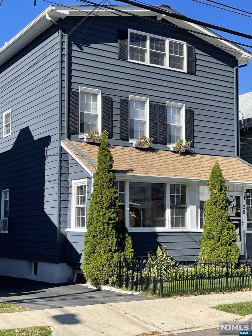 Inflation buster. Rent one unit and live in the other . First floor unit renovated 10 years ago. Second floor unit recently renovated with new walls, electric, kitchen, hardwood flooring, central air and heat. 3rd floor living room, office and storage, bathroom with laundry. New windows and roof. Full unfinished basement for plenty of storage or finish for additional space. Separate heat and electric. Detached oversized 1 car garage. Walk to restaurants, banks and retail stores.