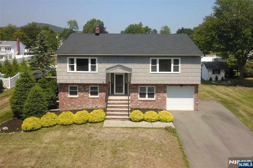 Welcome to where your dreams begin! This home is a rare gem, offering space, comfort, and versatility for expanded family living today's lifestyle. From the moment you step inside, you'll feel the warmth and natural light that fills every room. The main level features a spacious formal living room that flows into the formal dining room perfect for hosting holiday dinners or casual gatherings with friends. The updated eat-in kitchen boasts oak cabinets, newer appliances, and plenty of space to enjoy morning coffee while overlooking the yard. The primary suite is a relaxing retreat with a large picture window, walk-in closet, and partially updated full bath. Two additional bedrooms and another full bath complete this level, providing ample room for everyone. The lower level is truly special, designed with flexibility in mind. Whether for guests or an in-law suite, it offers everything needed for independent living. Highlights include a brand-new eat-in kitchen, a spacious living/dining area, a bedroom, and a den that can easily be converted into a fifth bedroom or office. A brand-new full bath with a shower stall adds ease and comfort, while direct access to the garage and backyard provides convenience and privacy. Outside, the backyard is a blank canvas ready for your imagination. Create a beautiful garden, set up a play area, or design the perfect spot for summer barbecues and evening gatherings under the stars.