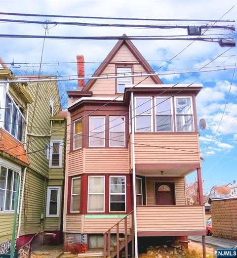 Photo of 12 Hopper Street, Paterson, NJ 07522 (MLS # 25038860)