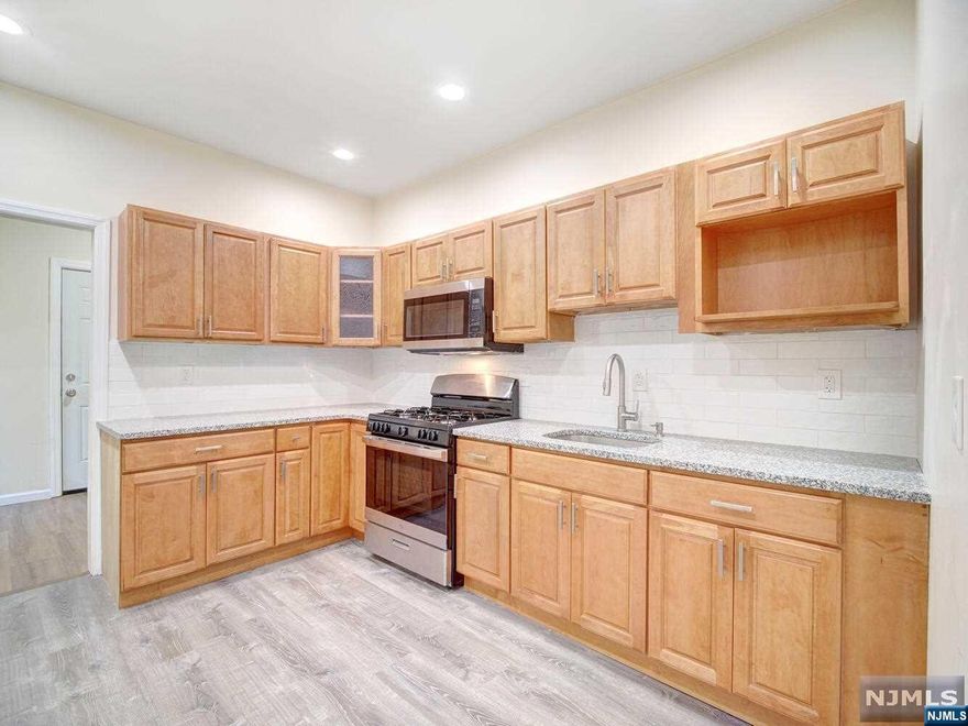 Welcome home to this sweet row home with EVERYTHING brand new. This 4 bedroom was meticulously gut renovated and prepared to be your next place to make home. First floor features a first level bedroom, full bath and laundry along with the new kitchen and access to a private deck space that overlooks a compact cleared backyard - ready for your own personal garden. Second level offers 2 nice sized bedrooms and a 4th bedroom/office alternative in addition to the main brand new bath. Unbelievably (currently) low taxes make this an easy payment - no matter the rate. Bring your belongings and get ready to enjoy home ownership!