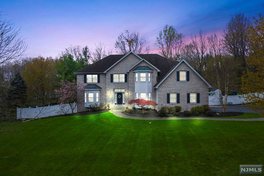 This Colonial style 4 bed 4 bath home sits on 1.48 acres in the serene Camelot Woods section of Mahwah. The main living space features a living room, formal dining room, and open concept kitchen with granite countertops and stainless steel appliances. The breakfast nook leads into a family room for gathering, where two additional doors allow direct access to the patio and backyard with an outdoor grill. A powder room and dedicated laundry room complete the first floor. Upstairs, the master bedroom boasts a walk-in-closet and luxury-style master bath that was recently renovated. An additional new bathroom and 3 spacious bedrooms complete this level. On the ground level, you will find the finished basement, updated in 2022 equipped with a bar and bathroom, and doors leading to the yard. An underground sprinkler system, fireplace, and plenty of windows for natural sunlight are just some additional highlights this property offers. Come tour this luxury home today!