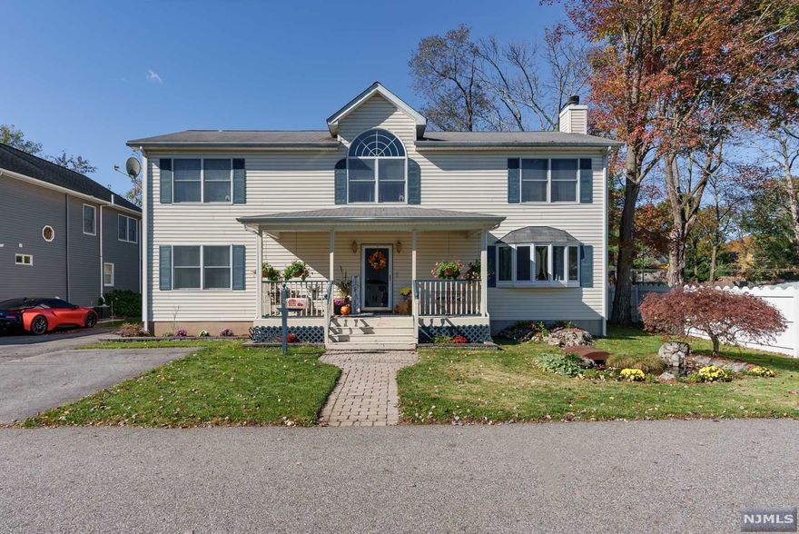 This is the one you've been waiting for, large colonial, ready to be your next Home! Relax on the charming covered front porch! Large entry foyer welcomes you into an Open Concept Living area that boasts a gorgeous fireplace that can be enjoyed from living room, dining room & even visible from the large eat in kitchen. Spacious kitchen features center island w/breakfast bar & built-in table, SGD to deck & rear yard. Bonus room perfect for guests, in-law, office or family room w/a beautiful powder room nearby. Bedrooms on second level are a good size & have many spectacular features, including cathedral ceiling, window seat, recessed lights, book nook & specialty windows. Spa-like MBR suite w/soaking tub & cathedral ceiling! Large basement features recreation room, workshop, laundry & huge storage area. Backyard is private oasis w/large deck w/pergola, above ground pool, horseshoe pits & lots of room to play & entertain! 1 Block from HS, close to NYC Express Bus, Rts 287 & 208!