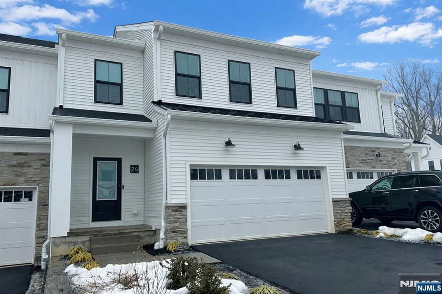 Brand-new 2025 Toll Brothers townhome for rent in the highly sought-after Oaks at Randolph community. This spacious and thoughtfully designed home features an open foyer leading to a sun-filled great room and dining area with direct access to the backyard. The modern kitchen offers a center island with breakfast bar, quartz countertops, ample cabinetry, and a walk-in pantry. Appliances include refrigerator, microwave, and in-unit washer and dryer. The second floor features three bedrooms, two full baths, a powder room, loft area, and laundry. The primary bedroom suite includes a walk-in closet and a luxurious bath with dual-sink vanity, shower, and private water closet. One additional bedroom also offers a walk-in closet. Finished basement provides flexible space for entertaining, recreation, or play and includes an additional powder room. Hardwood flooring throughout the main and upper levels, with durable LVP flooring in the basement. Additional storage throughout. Conveniently located near shopping, dining, and major commuter routes.