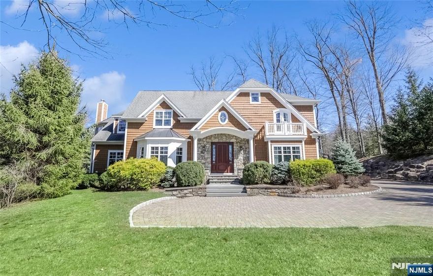 This exceptional 2008 custom Colonial, boasting 7 bedrooms and 6.5 baths across approximately 5,600 sq ft, offers unparalleled luxury. Nestled on a private .94-acre cul-de-sac lot with an in-ground heated pool and spa, this home is designed for grand living. A soaring two-story foyer welcomes you, leading to a living room, banquet-sized dining, and a gourmet custom kitchen. The family room with fireplace, library/bedroom suite, expansive mud room with seating off side entrance, 2nd staircase to upper level, and three-car garage add to the first floor's allure. Upstairs, a lavish primary suite with spa bath, plus 2 additional bedrooms, JnJ Bath, ensuite BR, and a bonus room, provide ample space. The walkout finished basement offers a recreation room, two full baths, bedroom, gym, and storage. Enjoy outdoor entertaining with a built-in kitchen and BBQ by the pool. Detailed moldings throughout, gleaming hardwood floors, an abundance of windows and a brick paver driveway complete this stunning residence.