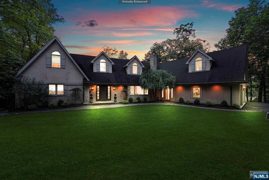 Your own private paradise, nestled in the prestigious East Hills of Englewood. Contemporary English country estate on 1+ glorious acre. 6 BR, 4.5 BTH, sleek modern kitchen, library, butler's pantry, oversized 2 car attached garage, 60 ft. deck, & more! Enjoy your enchanted oasis with its gorgeous pool, hot tub, & incredible water slide, amidst exquisite mature landscaping & sprawling back property. Spectacular views! A one-of-a-kind opportunity!