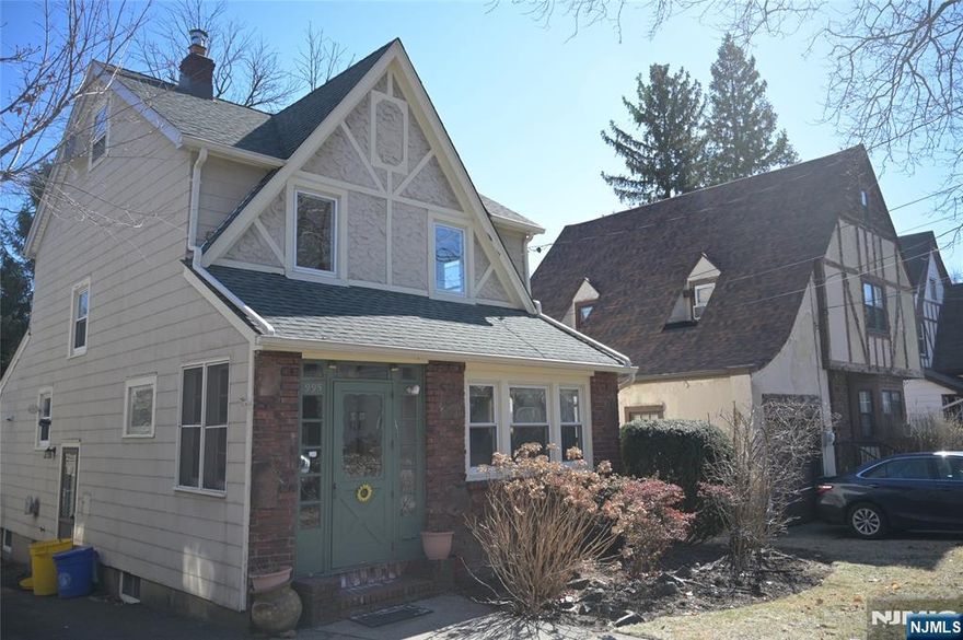 Welcome home to this classic Teaneck Tudor home! Hard wood floors throughout. The first floor has a nice sized living room and sun porch. The dining room is spacious enough for gathering comfortably. Nicely appointed kitchen with access to the backyard. the second floor has two good sized bedrooms and full bath. Bonus room on the third level. Great for a home office. The basement is finished. Laundry and full bath. Close to transportation, schools, shopping and houses of worship. Don't wait to see this! It will not last!