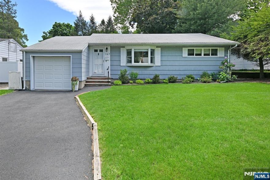 Welcome to this wonderful ranch in a desirable location of Emerson. Situated on a spacious 65 x 120 property with beautiful landscaping. One-floor living offers spacious living room with new bay window; large granite kitchen offers steps down to the sunroom with all new windows and doors with access into garage and yard. Two bedrooms are spacious and bright. Beautiful tile full bath. The basement is beautifully finished offering a wonderful family room, 2 spacious offices and a large utility/laundry room. The back yard is private and fully fenced. Central air, 3-year furnace, inground sprinkler system. So close to town center, train, bus, schools and parks! You will love living here! This is truly a turnkey home so come and unpack!