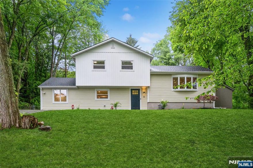 Welcome to this oversized split-level home in the heart of West Milford boasting a modern feel with fully renovated interior and exterior. This 5 bedrooms and 3 full bathrooms inviting house features functional layout with plenty of space to enjoy.The main level offers a bright and spacious living /dinning area, and a well-appointed kitchen with quarts countertops and stainless steel appliances including wine cooler, ideal for both everyday living and entertaining. Upstairs, you'll find three good size bedrooms and brand new full bath with double sinks. The ground level adds even more versatility including foyer, large family room with contemporary fireplace and gorgeous accent wall, two full bathrooms, another two bedrooms, laundry area, and direct access to the backyard. Further enhancing this home are two zone central AC, brand new siding, windows, roof and beautiful floors. Enjoy your own private outdoor oasis with in-ground pool, ideal for relaxing and having guests. This home offers comfort, charm, and beauty all in one!