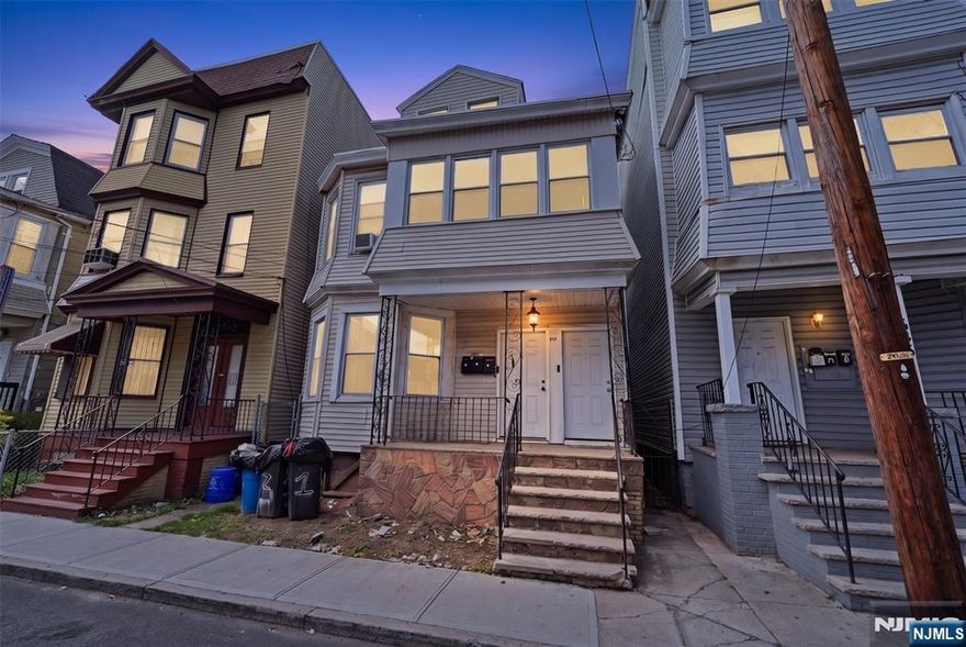 This legal two-family home features 8 bedrooms and 3 full baths on a quiet Newark street. The first and second floors each feature three bedrooms, an eat-in kitchen, and a living room. The third floor provides two bedrooms, a kitchen, and a living area. Move-in ready Close to shops, schools, parks, and public transportation. Minutes from major highways and Seton Hall University. Just 20 minutes to New York