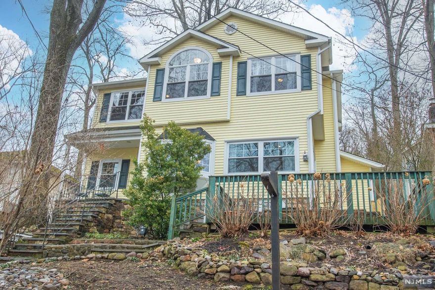 Pristine, Updated Colonial! Charming through & through! Bright, open layout with lovely Indian Lake views from every window. Renovated in 2017. Lovely Architectural Features, Give this Home a "Magnolia Homes Feeling.. Ya know, Chip & Joanne?! Living area boasts a cozy WB fireplace with built-ins for entertaining center & plenty of space for wood. Functional, updated kitchen w/center island. HIgh end, attention to detail features throughout, countertop to ceiling subway tile backsplash, focal point above gas oven, SS appliances & country sink. Opens to the dining area. Beautiful moldings & dark HW flooring throughout the 1st floor. Large powder room. 2nd floor offers 3 BDRMS including a lovely master w/cathedral ceilings, a generous walk-in closet w/built in shoe racks & Jack n Jill access to the bath boasted both a stall shower & jet tub. Convenient 2nd floor laundry. Tons of storage in the pull down attic, basement or 1 car garage. Great outdoor space..