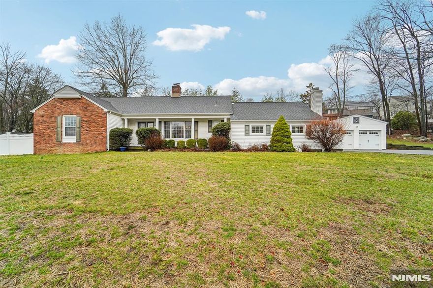 Spacious, versatile, and charming, this home checks all the boxes. The heart of the home is an expansive eat-in kitchen featuring a center island and sliding glass doors that open to the backyard perfect for indoor-outdoor living. Just off the kitchen, an enormous family room/playroom offers endless possibilities for gatherings, relaxation, or recreation. The first floor also includes a formal dining room and a cozy living room with a wood burning fireplace. You'll find two bedrooms and two full baths including the primary suite. On the second floor you will find two more spacious bedrooms. This home is complete with a breezeway/mudroom which connects the home to the oversized two car garage and offers is own exterior entrance, ideal for busy lifestyle. The attached garage offers ample storage space and a bonus room which leads to the rear yard and pool area. It is the perfect blank slate for a pool house, cabana or entertaining space. With exceptional curb appeal.... don't let this home pass you by. Make your appointment today!