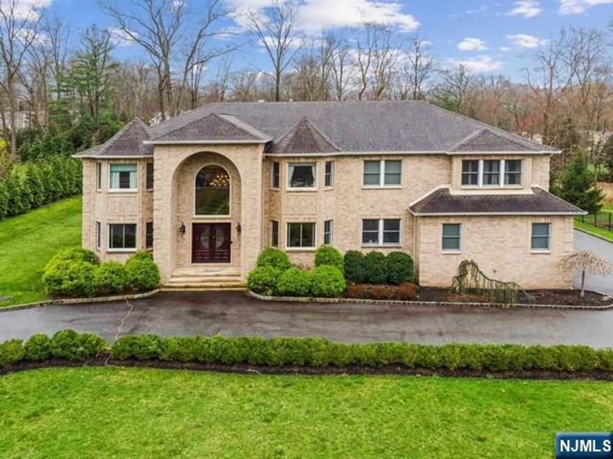 Rarely does a rental of this caliber become available. A grand two-story foyer with a sweeping bridal staircase sets the tone for this exceptional home. The gourmet kitchen opens seamlessly to a dramatic great room with soaring 20-foot ceilings and a striking stone and marble fireplace. Extensive millwork, along with marble and hardwood floors, adds timeless elegance throughout. The upper level features generously sized bedrooms, each with vaulted or tray ceilings. The primary suite is truly spectacular, offering a sitting area, custom closets, and a spa-inspired bath with radiant heated floors. The expansive property and rear patio create the perfect setting for outdoor entertaining. Additional highlights include a full-house generator and EV charger. A rare opportunity in Upper Saddle River. AVAILABLE FOR SHORT TERM RENTAL FOR WORLD CUP
