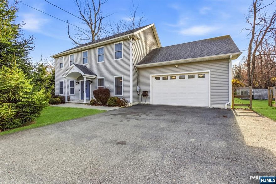 Welcome to Lake Hopatcong living at its finest, where lifestyle, convenience, and value converge in one of Sussex County's most sought-after settings. This newer Colonial offers a bright, open layout with high ceilings and a striking stone wood-burning fireplace that anchors the main living space with warmth and character. The kitchen flows seamlessly to a rear deck overlooking a newly fenced backyard oasis featuring an above-ground pool and expanded landscaping, perfectly designed for entertaining, relaxing, and enjoying the seasons. The primary suite offers a private retreat with a walk-in closet, en-suite bath with double sinks, and a versatile bonus room ideal for a bedroom, home office, gym, or sitting area. Additional highlights include newer appliances, ceiling fans, abundant storage, and a climate-controlled garage. Major upgrades such as exterior French drain improvements, public sewer, and upcoming natural gas service provide long-term value and peace of mind. Located just moments from the energy of Lake Hopatcong, yet offering space and privacy, opportunities like this don't come around often. This is one you need to experience in person, schedule your private tour today before it's gone. *Property sits on Double Lot, Includes Lot 27 and 29 as per deed. USDA Eligible for $0 Down Payment Loan Program