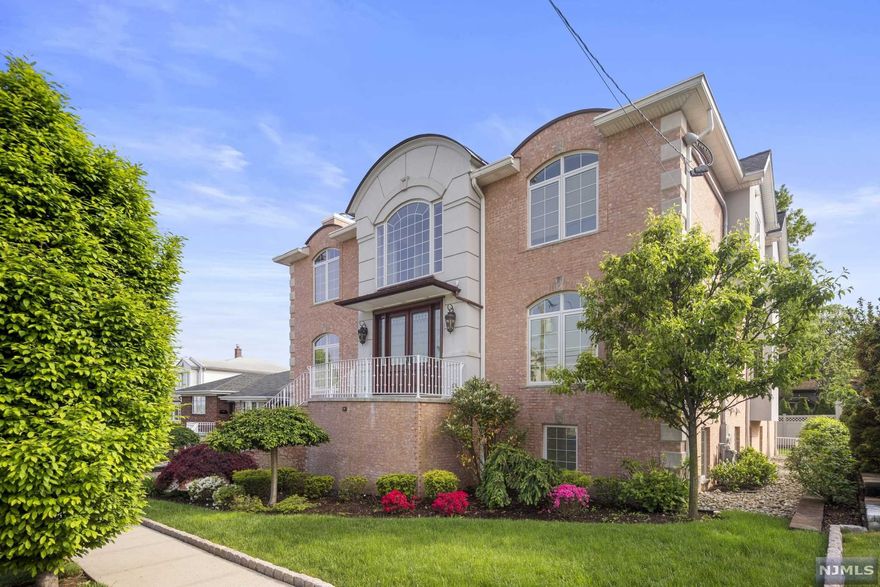 Meticulously designed 5 BR, 4 full & 2 half bath Colonial w/ approx 7,277 interior sq ft located on a quiet dead-end street in the most desirable area of Cliffside Pk. This oversized lot (69x100) is rare. 1st floor features Living Room w/ gas fireplace, TV room w/ surround sound Sonos, formal Dining Room, Kitchen w/ Wolf Stovetop-Range, Sub-Zero refrigerator w/ add'l freezer drawer, Miele dishwasher, extra-large farmhouse sink, Terrazzo floors, powder rm, wet-bar, and large W/D rm. Enter outdoor patio from kitchen and enjoy al fresco dining while overlooking views of NYC. 2nd floor features master BR w/ dual vanity, stand-alone shower, soaker tub, private outdoor wraparound balcony, bonus loft space & gas fireplace. 2nd floor includes, 3 BR's & 2 full bathrooms, and add'l laundry rm. Ground floor includes rec rm, office, 1 BR w/ private ensuite bath, add'l half bath, 2-car garage. Backyard includes two gas grilles, one smoke grill, firepit & lounge area.