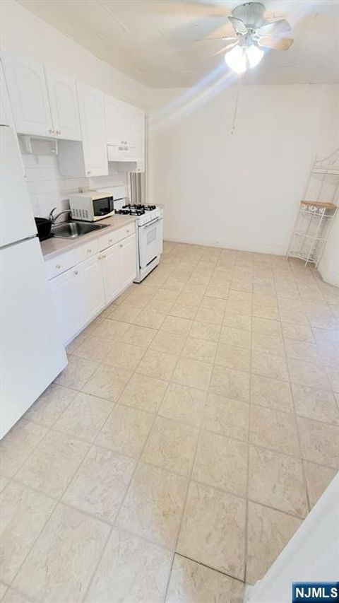 Photo of 427 Sherman Pl, Fairview, NJ 07022 (MLS # 25036528)