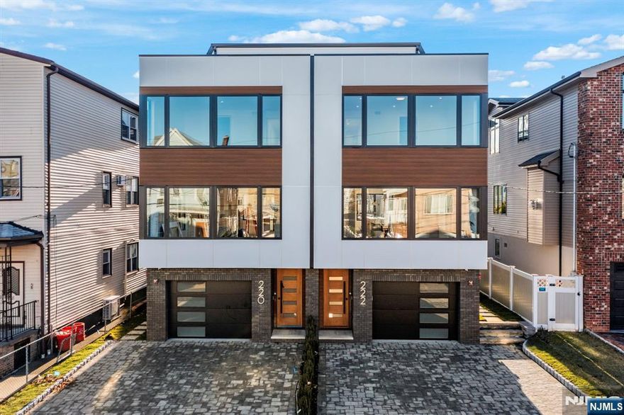 Designed & Built by SILVERLINE --- AMAZING MANHATTAN VIEW FROM PRIVATE ROOFTOP --- This 4-level contemporary 4BD 4BA townhome in central Cliffside Park offers unobstructed NYC views from its private rooftop terrace. Featuring large windows, modern European White Oak flooring, and abundant LED lighting, this home is an architectural gem. The ground level includes a bedroom, full bath, and a spacious rec room with a wet bar and access to a fenced backyard. The 2nd level showcases an open living and dining area with a private deck and a stunning gourmet chefâ€™s kitchen with European cabinets, integrated appliances, wine cooler, and grand island. The 3rd level offers 3 bedrooms and 2 baths, including a spa-like primary suite with heated floors, freestanding tub, and rainfall shower. The top floor boasts a versatile open area that can serve as a rec room, bedroom, or office, complete with a full bath, wet bar, and access to the rooftop terrace with unobstructed breathtaking NYC views