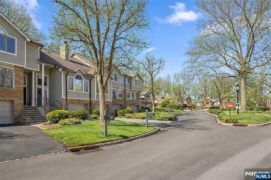 Welcome to 5 Lakeview Drive in the highly desirable Lakeview Estates of Old Tappan. This beautifully updated 3-bedroom, 4-bath townhome offers an open layout with soaring ceilings and abundant natural light. A Stunning two-story foyer opens to an impressive great room with fireplace and oversized windows, creating an airy and inviting space. The dining area flows seamlessly into a renovated kitchen with modern finishes and a bright breakfast area with sliding doors leading to a private deck with peaceful lake views. The first-floor primary suite features a vaulted ceiling, walk-in closet, and a spa-like bath with elegant finishes. Upstairs, two generously sized bedrooms are complemented by a renovated second-floor bathroom. The fully finished lower level provides additional living space with a large family room, bonus room ideal for office or gym, and a renovated half bath. A true highlight is the full-sized, attached two-car garage with two separate garage doors direct interior access, featuring brand-new epoxy flooring and new garage openers with built-in cameras. This rare feature offers protected parking and valuable storage. Residents enjoy access to the clubhouse, pool, fitness center, and tree-lined streets. Convenient to shopping, dining, and NYC transportation, and located in Old Tappanâ€™s top-rated school district. A rare opportunity to own a turnkey home in one of Bergen Countyâ€™s most desirable communities.