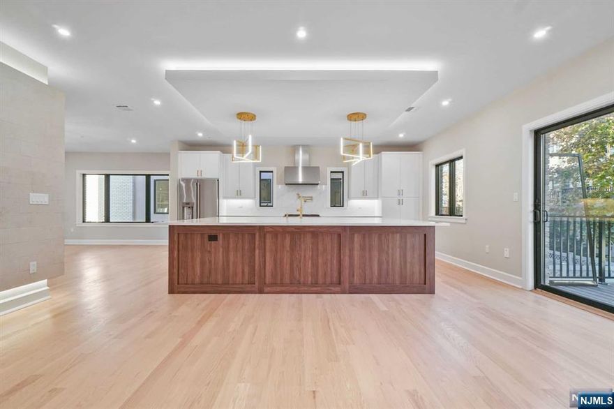 Welcome to 804 W End, one of the LARGEST duplex units to hit the Cliffside Park Market. This High End Duplex w/ Private Rooftop has been built by one of Gold Coast's Top Builders, JZS Developers and spans an impressive 4,500+ sqft and offers 4 bdrm, 5.1 bth. First floor's oversized layout offers a kitchen w. Top Line Stainless Steel appliances, qtz counters / backsplash & OVERSIZED waterfall island, professionally designed pwdr room, EIK with custom built-ins and see through fireplace, LR and DR with fireplace, wide white oak floors and direct access to private terrace / deck off kitchen. Second floor consists of Mbdrm with 2 w/i closets, Mbthrm w/ XL rainfall shower, heated floors and Double Vanity. Completing this floor are 2 XL Bdrms both w. ensuite Fbth, laundry rm. Third floor offers a large rec room / bedroom with RARE Fbth & closet off your private rooftop. Your ground level offers a large Rec Rm w. wet bar, Fbth, custom built in mudroom, oversized garage and prvt-patio.