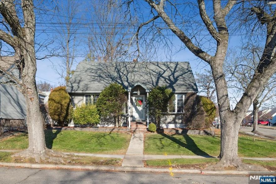 Set on a sunny corner lot along a quiet residential street, this Cape Cod home offers a wonderful opportunity in the heart of Bloomfield. With a classic layout, hardwood floors, and generous space, this home is ideal for buyers looking to add their own personal touch in a prime location.The main level welcomes you with a spacious living room filled with natural light from charming bay window, flowing into the dining area and kitchen. Two bedrooms including a first-floor primary bedroom and a full bathroom complete this level. A small porch leads directly to the fenced backyard, offering a great canvas for outdoor living, while the attached one-car garage adds everyday convenience.Upstairs, two large bedrooms provide flexible space for future bedrooms, a home office, or creative use. Hardwood floors throughout the main and second floors add warmth and character and ready to be refreshed.The full basement is partially finished with a wood bar and corner bench, along with a laundry area and an additional toilet with sink. With vision and updates, this level can be transformed into an amazing recreation room, workspace, or extended living area. Just minutes to NYC transportation, Bloomfield train stations, major highways, parks, shops, and dining this solid home offers great bones, space, and an unbeatable setting.