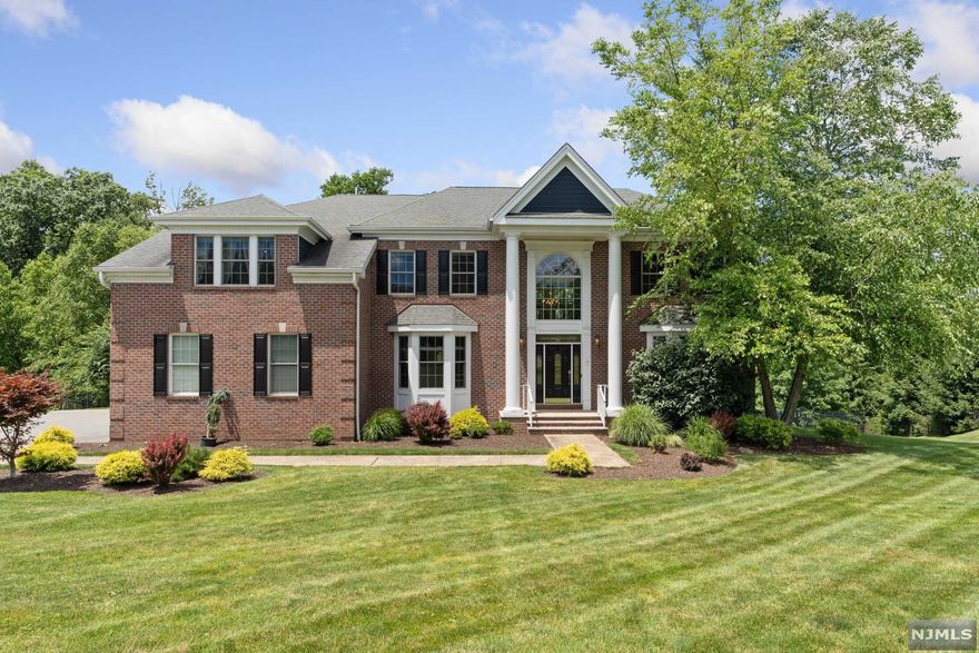 Located in one of North Caldwell's most prestigious neighborhoods, known as "Hilltop Estates . This exquisite center hall colonial, sits on .87 acres of gorgeous landscaped property, has it all! Its location is convenient to commuter routes yet provides you w/ seclusion, privacy & solitude. A grand 2 story foyer welcomes you w/ a dramatic staircase & shows off the open floor plan, allowing for great entertaining or everyday living. Gourmet eat-in kitchen feat. stainless steel appliances, granite counters, center island, pantry & opens to the 2-story great room. Main level also hosts a formal living & dining room, sun room, office, powder & laundry room. Upper level provides 4 spacious bedrooms including the master bedroom suite w/ lavish bath, sitting room, gas fireplace & 2 walk-in closets & 2nd fl laundry closet. Walk-out lower level incl. family room, gym & plenty of storage. Top rated school district. Close to the bus/train to NYC, major highways, restaurants & so much more.