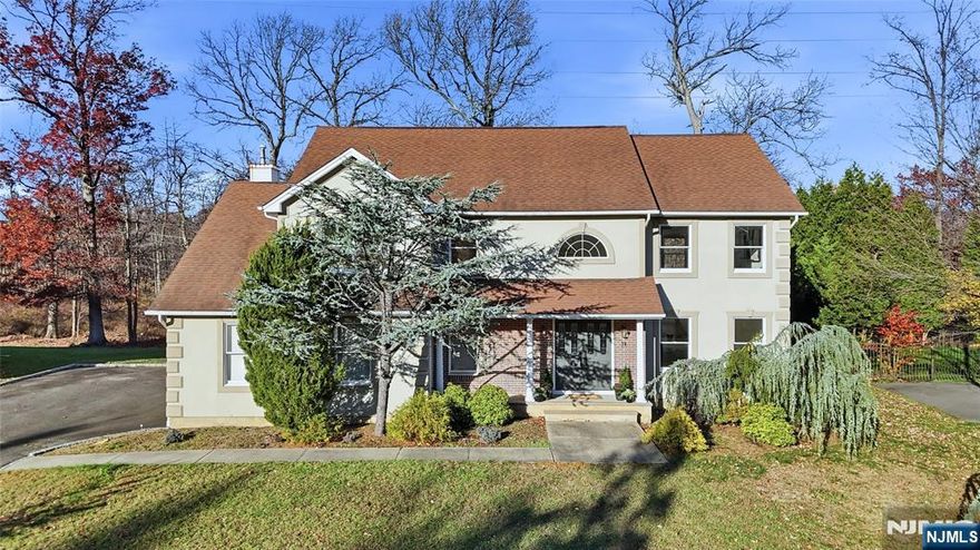 Welcome to 28 McGuire Drive, a beautiful 3-bedroom, 2.1-bath Colonial set in one of West Orange's most desirable enclaves of newer homes. Built in 1999 with high-quality finishes, this home offers the space, comfort, and neighborhood setting today's buyers want, along with the opportunity to update at your own pace and build long-term value. The main level features an inviting double-height foyer, sun-filled living and dining rooms, and a generous eat-in kitchen with abundant storage. The eat-in kitchen flows directly into the family room and the deck, an ideal setup for relaxing, entertaining, and staying connected. A powder room, laundry area, and attached garage complete the first floor. Upstairs, the spacious primary suite includes a walk-in closet, sitting area and large bath with shower, tub and vanity with double sinks. Two additional, generously sized bedrooms (one complete with a bonus room) and a second full bath offer the flexibility needed for guests, a home office, or future lifestyle changes. The high-ceiling basement provides exceptional storage and the potential for additional finished space. Outside, enjoy a level yard and the quiet, tree-lined streets. This premium neighborhood is known for wide roads, pride of ownership, and close proximity to NYC transportation, Eagle Rock Reservation, schools, shopping, and dining. This home delivers immediate livability plus room to design your next chapterâ€”a rare opportunity in a consistently high-demand location.