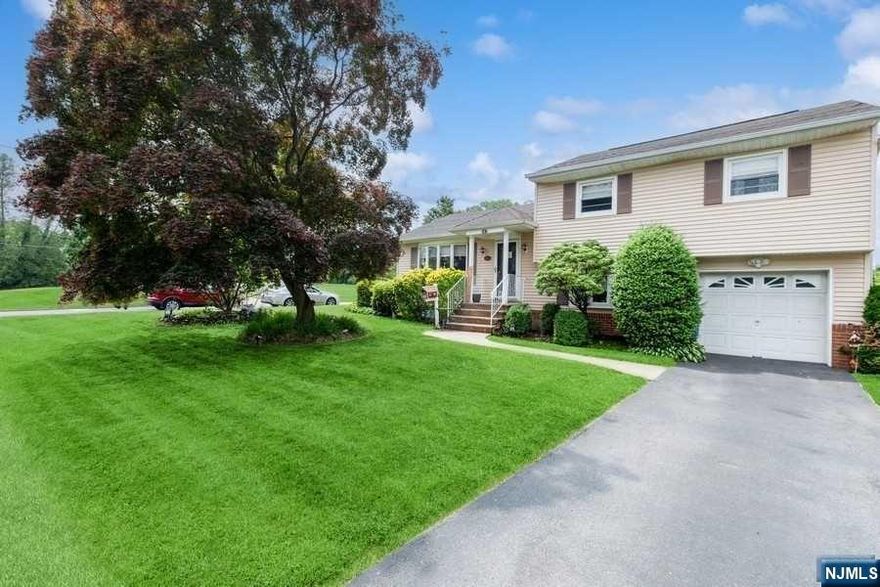 Welcome to this beautiful, move in ready split level home on a lovely corner lot in Emerson. Home has 3 bedrooms, 1.5 bathrooms and a fully updated kitchen and bathrooms. The eat in kitchen has modern stainless steel appliances, quartz countertops, and a large island with stools surrounding it. This is open concept living at it's finest! There are hardwood floors and high hats throughout. Big composite deck allows for minimal maintenance, and the furnace is very high efficiency. There is a new fence surrounding the large parklike backyard which has a newer deck that is perfect for entertaining. Convenient to NYC transportation, shopping, restaurants and schools.