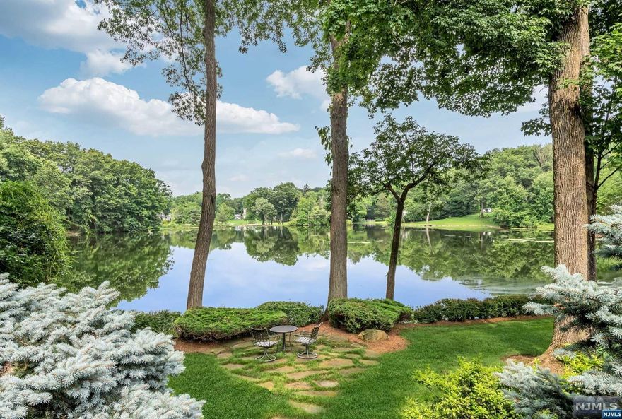 Discover your new life at the water's edge - where every day is a journey into serenity and natural beauty. Only 16 houses surround this pristine lake where you can enjoy total privacy and breathtaking views that come with every season. Jump in a canoe or kayak from your dock, cast a fishing line, or sit under a shade tree and watch the swans and herons. Rebuilt and expanded by current owners, enjoy approx. 6000 sf well planned customized detail that was designed to optimize the lake experience. Enjoy views through walls of windows in the 2-sty GR that is open to the chef's kitchen, sun rm and screened porch. Formal LR and DR have French doors to the covered porch. All BR's are spacious and private, especially the owners suite with luxe spa bth, WIC and, yes, more lake views! The work-from-home office also works as a 5th BR! The grade level Fam/Media Rm boasts a wine room and custom wet bar. As a Shadow Lakes Club member, enjoy access to the pool, tennis, boating and new friends!