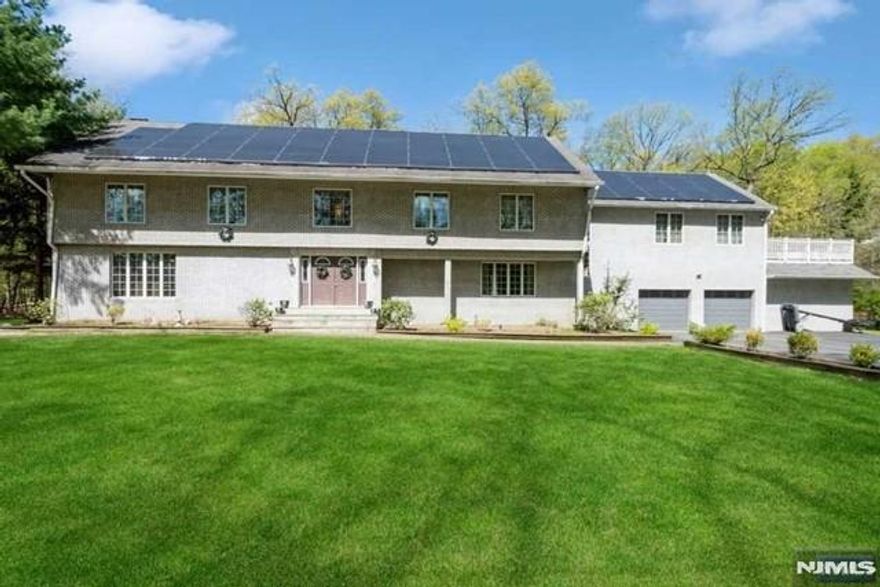 Great home located on a quiet street in a country lane setting. Plenty of space inside and out. Grand, 2-story entry foyer leads to the large living room with a bay window. Massive gourmet kitchen with 2 sinks, built-in wine rack, granite countertops, and a large eat-in area. Formal dining room with fireplace. The grand family room has plenty of space to spread out. Laundry on the main level. The expansive Deck leads out to a large, private yard, providing plenty of space for entertaining. Close to great schools, parks, restaurants, and shopping. Easy Highway access and close to the downtown Ramsey Commuter Train!