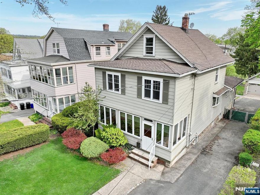 Welcome to this charming side hall Colonial nestled in the heart of Bloomfield, offering the perfect blend of classic character and everyday functionality. The first floor features a sunny enclosed front porch, a formal living room, and a formal dining room ideal for entertaining. A comfortable family room provides the perfect space to relax or host guests, while the nicely sized kitchen offers ample room for cooking. A full bath with a stall shower completes the main level. Upstairs, youâ€™ll find three bedrooms and a full bathroom with a tub. A walk-up attic provides additional storage, and a full unfinished basement with a laundry area adds even more practicality. Outside, enjoy a two-car garage and a deck overlooking the yard, which backs directly to Pulaski Park for added privacy and scenic views. Conveniently located near NYC transportation and a vibrant downtown, this home offers both comfort and accessibility in a desirable location