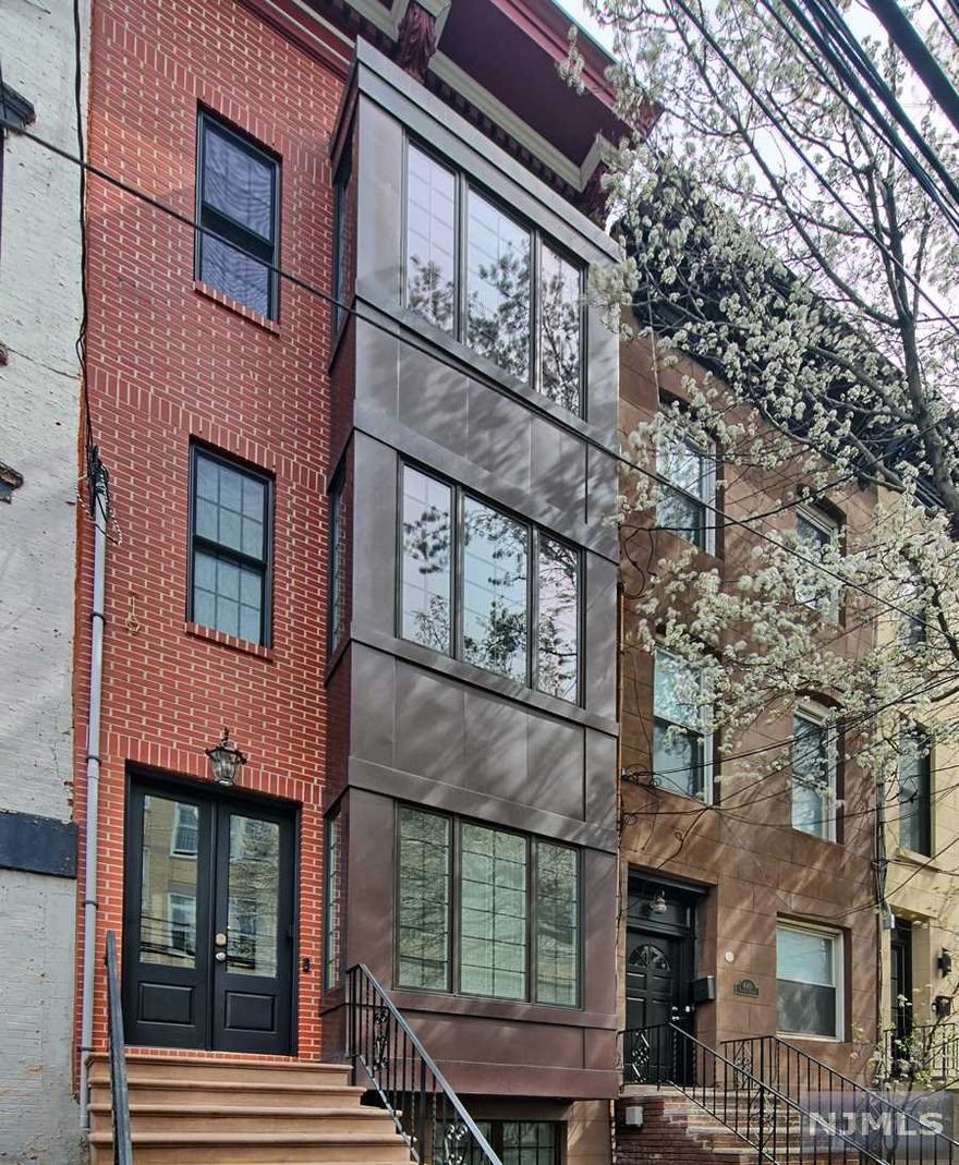Welcome to this move-in ready 3 story single family at a prime location in Uptown Hoboken. Home is embraced with natural light, exposed brick, gleaming hardwood floors throughout. Open Kitchen with granite countertops, ss appliances, center island, hooded vent, custom pantry and plenty of storage space. Walk out into the backyard with custom blue slate patio along with turf & grill. Second floor offers spacious Master bedroom with en-suite master bathroom which has a full-large shower, jacuzzi, double sink, exposed brick and a huge walk-in closet. Second room/office offers generous closet space and custom built shelves along the walls. Kids bedroom with terrace, playroom with gigantic attic, guest bedroom, full bathroom , ton of storage space on the third floor. Finished basement with extra room/office on the ground level. Complete Wi-Fi systems with boosters & sound system with indoor/outdoor speakers. Close to Restaurants, transportation and more!
