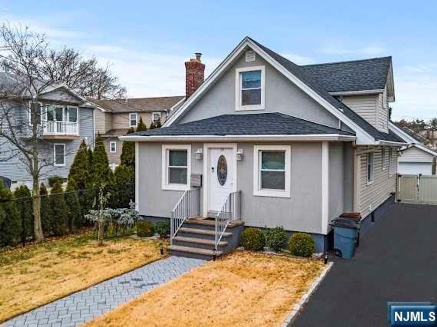 Impeccably renovated Cape style house located in residential neighborhood minutes from NYC bus&train.This stunning home offers a perfect blend of elegance and modern style w/high quality finishes throughout.Boasting 3 Bdrms,3 full baths and finished Bsmt this home has endless possibilities.As you step inside you will be welcomed by an inviting first floor featuring a seamless flow from the elegant LivRm to a Din area and a modern Kitchen.This Kitchen is equipped with SS Appl's and offers ample counter and storage space.Custom built-in bookshelves and a unique stone accent wall add character and charm to the living space.Additionally 2 Bdrms and full Bath can be found on the first floor providing convenience and comfort.Venture upstairs to discover a luxurious private suite with a sitting area and full Bath.Finished Bsmt.Gleaming Hdwd Flrs,recessed lighting,multi-zone heat & central A/C,newer roof,siding,plumbing,200 Amp electric.Fenced in backyard,1 car garage.COMMUTERS DELIGHT!