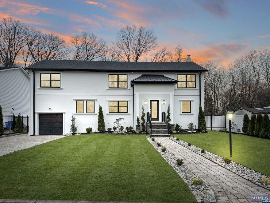 Welcome to this exquisite fully renovated home nestled in the heart of Paramus. Boasting 5 bedrooms and 4 impeccable full bathrooms, this residence is a testament to luxury and craftsmanship with stunning finishes throughout the home that reflect a commitment to quality and style. As you enter, you'll be greeted by an abundance of natural light that fills every corner of the house, creating a warm and inviting atmosphere along with white oak hardwood floors throughout the house. The heart of this exceptional home lies in its meticulously designed kitchen, a custom-built masterpiece featuring a kitchen island adorned with Calacatta lava quartz countertops. The attention to detail is evident in every corner, with top-of-the-line Cafe appliances enhancing both functionality and style. The kitchen becomes a culinary haven, promising a perfect blend of aesthetics and practicality. Conveniently located near major highways and proximity to NYC transportation