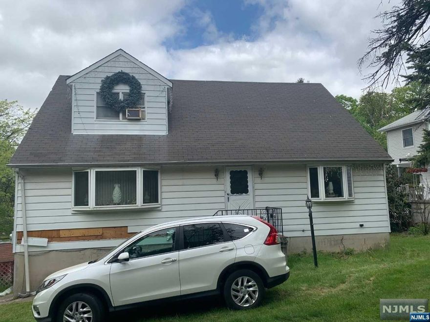Spacious 4 bedroom Cape Cod home located near Garret Mountain Reservation. New Furnace, Eat in kitchen. Very bright and sunny. Short Sale, subject to 3rd party authorization, as is condition.