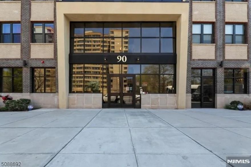 Welcome to Lofts at Lincoln Park and open concept living. This impeccably maintained two-bedroom, two bath residence offers an exceptional blend of comfort and sophistication, featuring gleaming hardwood floors, recessed lighting. The primary suite features a private en-suite bath with double vanity and generous walk-in closet. The contemporary white kitchen is thoughtfully designed with granite countertops breakfast bar that seamlessly overlooks the family room- ideal for both everyday living and entertaining. Residents enjoy access to a private professionally landscaped courtyard, fully equipped fitness center and assigned garage parking space. The building is enhanced by a new secure fob-entry system with video, providing both privacy and peace of mind. Ideally situated near NJPAC, The Prudential Center, Newark Airport, fine dining and public transportation, This residence offers the perfect balance of luxury, convenience and urban accessibility. Tax abatement expires on 8/31/2033. Not FHA approved.