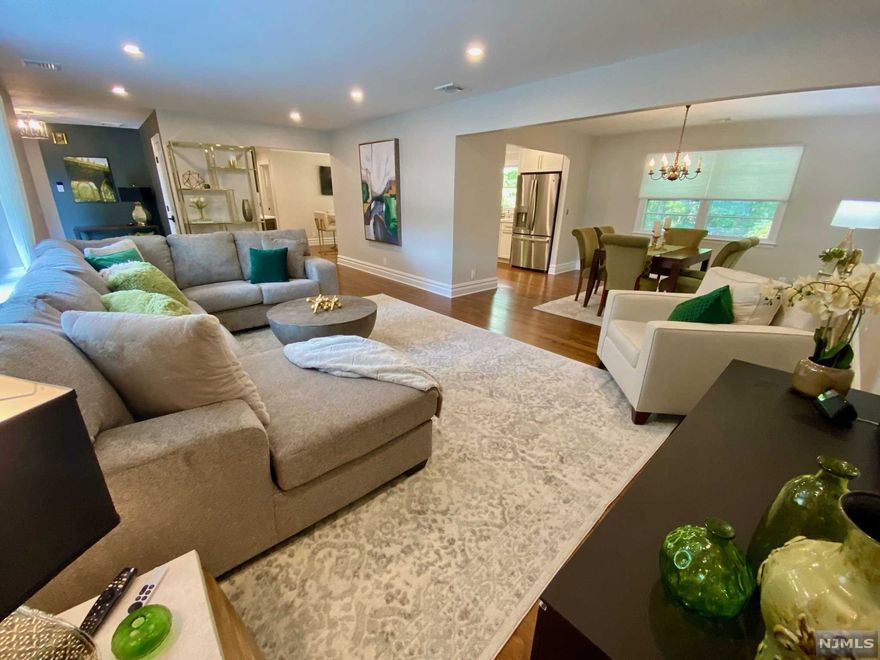 COMPLETELY RENOV (2022) SMART Home w/4 Bdrms & 2.5 Bths on .9 Acre of Park-like Property on a quiet St. FABULOUS Open Layout w/a 24' LR into DR. STUNNING Chef's EIK w/Quartz top Island that seats 5, S/S Appliances, Bar w/Bev Fridge & MORE! On the other side are the Primary Bdrm w/Bath plus 2 more Bdrms & Hall Bath completing the Main Flr. Walk-out Ground Lvl has 4th Bdrm/Fam Rm, 1/2 Bath (w/space to add shower), Laundry, Gar entry, & Storage Rm w/gym area. Huge, Private yard w/ mature trees, custom landscape lighting, 2 sheds and the 2-tiered deck off the kitchen offer plenty of space for relaxing & entertaining. Some of the MANY UPGRADES include NEW: Elect Panel, HVAC, Radiant Flr Heat in Bthrms, Exterior Doors, Solid Wood Interior Doors w/Designer Hardware, Custom Closet Systems, HRDWD Flrs thruout Main Level, Low Maintenance Vinyl Flrs on Grnd Level, Ring Doorbell, Nest Thermometer & MORE! Conveniently located near shops, dining, schools, parks & trans. DON'T MISS THIS ONE!