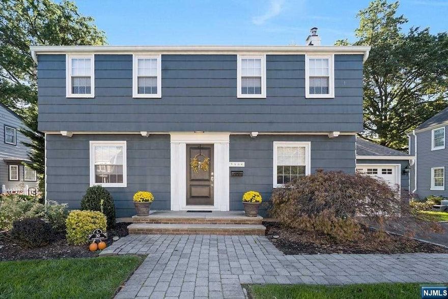 Welcome to this beautiful Brookdale center hall Colonial that is move in ready. The entrance foyer leads to the living room with fireplace, formal dining room, updated EIK with granite counters and new appliances, half bath. Three season sun filled porch off of living room, perfect place to relax. Upstairs to 3 bedrooms, full bath featuring jetted tub. Beautiful hardwood floors thru out home, finished family room located in basement. Recent updates include gas furnace, roof, central air & hot water heater. The home is located on oversized lot within walking distance to Brookdale Park, shopping & restaurants. Easy commute to NYC.