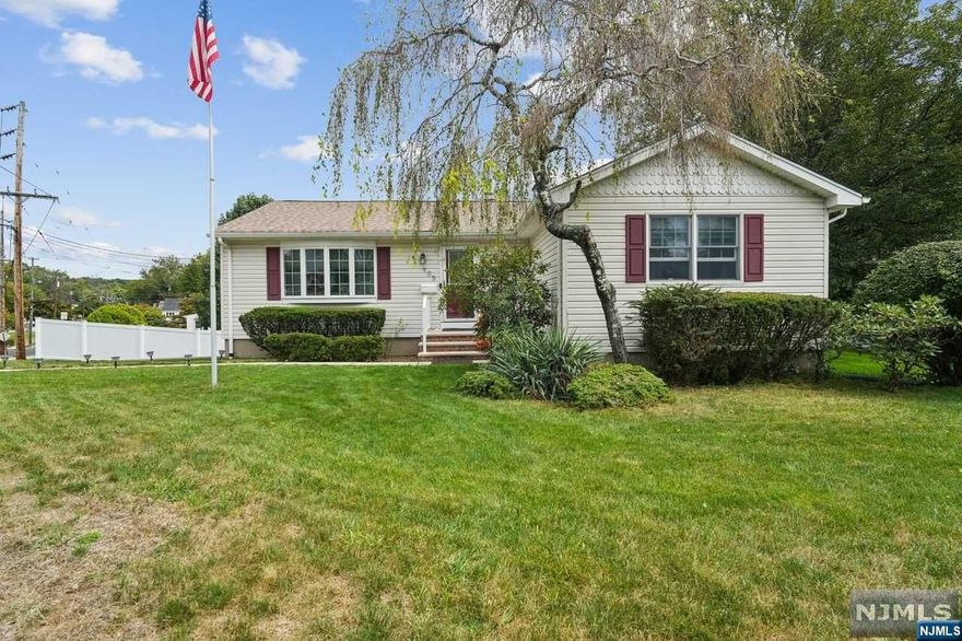 Corner lot home in Pompton Lakes!This 3BR/2Ba home is ready for its new owners. Walk up the new steps into the frnt dr and enter your LR w/hrdwd flrs and bay style wndws to let in the natural light.Off of the LR is a DR that leads into an EIK w/grnte cntrtps and island.The hall off the kitchen offers an updated full BA as well as 3BR's, all with beautiful hrdwd flrs. Take the strway to the basement to find a large family/rec room.The basement also boasts a full BA w/walk in shower, bonus room (which can be made into a lrge offce), lndry/utility rm and mud rm which has sliders leading to the huge patio/back yard space.Back yard was completely redone w/vinyl fencing, pavers and retaining walls.Great area to enjoy the beautiful days and evenings! Security cameras also come w/this home.Close to schools, parks, shopping, and public transprtatn. There is a new driveway leading to built in garage with auto opener.EZ hkup to frnce for generator.Make your appntmnt b4 this one is gone!