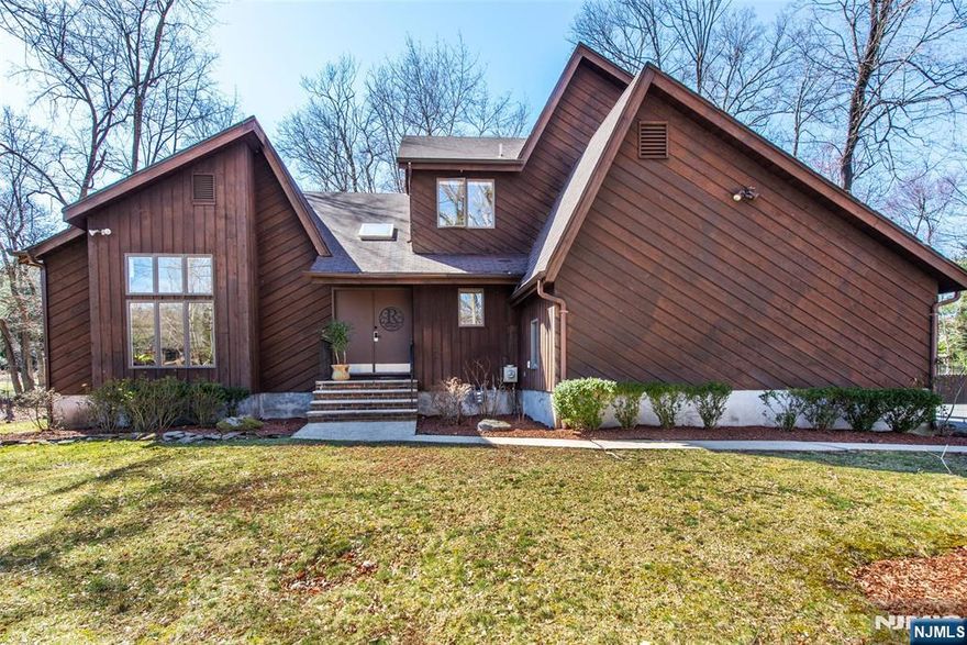 Welcome to your retreat in Haworth - offering the ultimate in privacy - located in a cul de sac, down your long private driveway ,32,000 plus sq feet of flat land surrounded by natural beauty. Contemporary design, built in 1985, w/3124 sq ft. on 2 floors & an additional 1300 sq ft in basement. Double heighted entry foyer with loads of natural light pouring in thru the large windows and the skylights thruout the house. Expertly designed with an open feel in mind having a seamless flow - great for entertaining. On the 1st floor -the kitchen , dedicated home office and family room w/fireplace overlook the backyard while the dining room and living room look upon the natural beauty of your very private front yard. Second floor offers 4 spacious bedrooms again flooded with light. Spacious primary has en suite primary bath with skylights. Finished basement features rec room, den/flex room, full bath, very large unfinished storage area. 12 miles to GWB to NYC; Top rated Blue Ribbon schools.