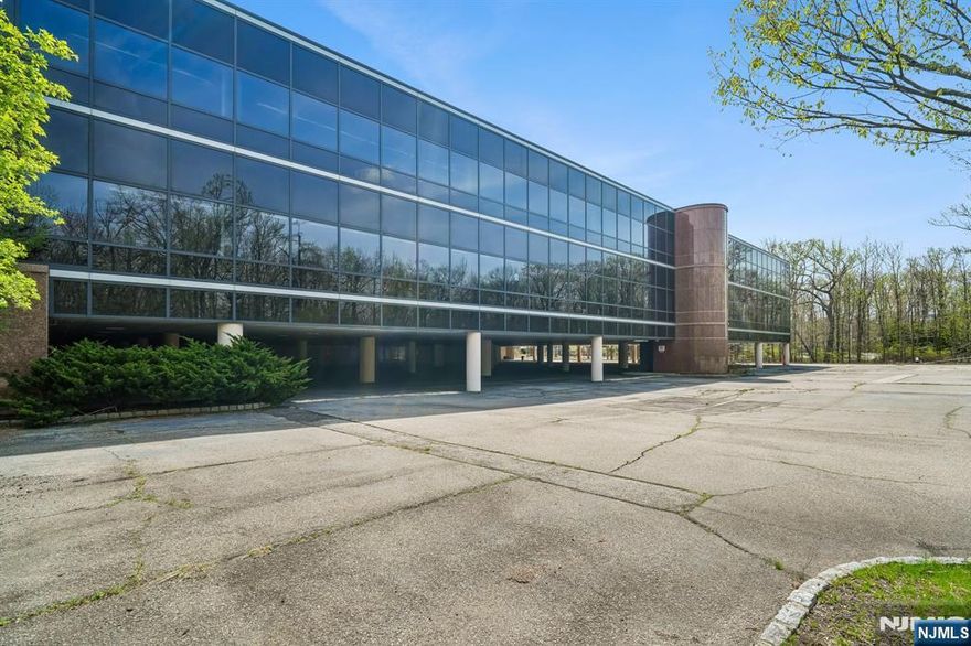 Exceptional opportunity to acquire a premier corporate office property located along the highly sought-after Sylvan Avenue corridor in Englewood Cliffs, New Jersey. This freestanding 66,000 SF office building sits on approximately 5.39 acres and offers outstanding visibility, accessibility, and redevelopment potential. Originally designed for corporate headquarters use, the property features expansive floor plates, a dramatic central atrium lobby, and flexible layout configurations ideal for a wide range of uses including corporate offices, medical, educational, or repositioning/redevelopment opportunities. Strategically positioned just minutes from the George Washington Bridge, the property provides seamless access to Manhattan and major Northern New Jersey highways, making it an ideal location for regional or national headquarters. The building is currently in white-box condition, offering investors and end-users a rare chance to customize or redevelop to their specific needs. Generous on-site parking and strong surrounding demographics further enhance the long-term value of this asset. Located within one of Bergen Countyâ€™s most prestigious commercial corridors, often referred to as the â€œBillion Dollar Mile,â€ this offering represents a unique value-add investment with significant upside potential.
