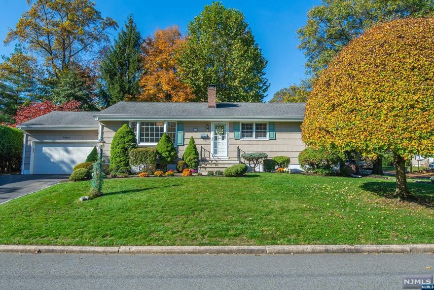 1-floor living! Renovated 3-BR, 1.5 bth ranch w new custom EIK, open plan, attached 2-car garage, fam rm, deck, private backyard, off quiet dead-end, near parks, schools, shops & NYC transport. Foyer w closet. Open concept LR/DR w bay window, HW fls & gas FP. DR w French doors open to big fam rm w windows facing private backyard & sliders to deck & landscaped back lawn. EIK, open to LR, has new SS appls, HW fls, builtin pantry, custom cabinets, quartz counters, peninsula, subway tile backsplash, recessed LEDs, soft-close drawers & skylight. From the EIK there's access to full basement & pocket door to fam rm. Wide hallway leads to beautiful full bath w quartz vanity & tub/shower. Pulldown attic & 3 generous BRs, incl primary w powder rm & 2 closets. Full unfinished basement w new plumbing, laundry, & storage rm. Garage w storage & access to backyard. 1 mile to shops, restaurants & NYC train. Fully renovated, truly move-in ready! Chimney, FP, flues sold "as is".