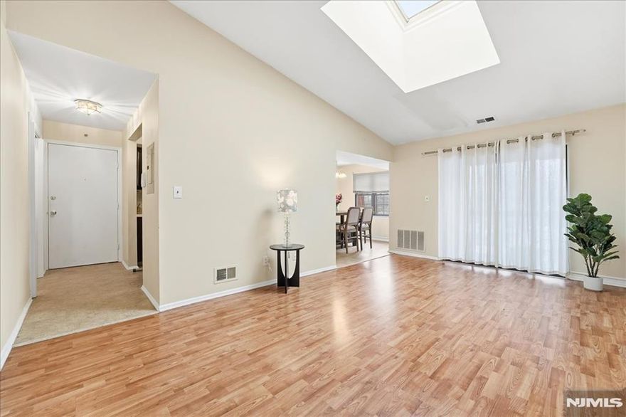 Beautifully maintained 3rd floor penthouse unit featuring 2 bedrooms and 2 full bathrooms in desirable Aspen Manor offering a bright and spacious layout with thoughtful design throughout. The Great Room with lofted ceiling and skylight welcomes an abundance of natural light with sliding glass doors leading to a private balcony, creating a light and airy feel. A formal dining area flows seamlessly into the well-appointed kitchen with ample cabinetry and functionality. The primary suite includes a full bathroom and generous closet space, while the second bedroom and additional full bath provide flexibility for guests, a home office, or additional living space. Enjoy access to community amenities including a clubhouse, outdoor pool, tennis courts, and playground. A wonderful opportunity to own in a sought-after community.