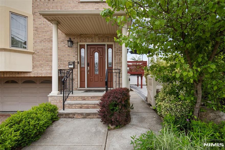 Meticulously renovated and maintained, this all-brick duplex blends classic elegance with high-end upgrades. Recent major improvements include a reimagined kitchen, updated bathrooms, a fully redesigned yard, freshly painted walls, a newer dishwasher, and more. The first floor features 9-foot ceilings, hardwood floors, and includes a living room, a formal dining room, an eat-in kitchen filled with morning sun, and a powder room. The 2nd floor offers the primary suite with walk-in closets and a skylit ensuite, plus two additional bedrooms and a full bathroom. The finished lower level features a bedroom with a full bath, and a private entrance with direct yard access. Complete with a two-car garage and a comprehensive smart-home suite (Ring, Nest, MyQ), this bright, turn-key home is located just steps from direct NYC transit. ListingAgent-LilianaMilitaru-9143305922