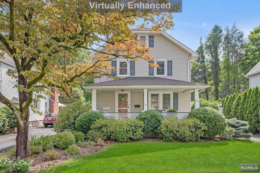 This Classic 1920's Colonial Charmer with lemonade porch has been brilliantly expanded & impeccably maintained! Lounge in the Large Living Room w/built-in book cases. Feast in the Dining Room open to spacious Kitchen & Family Room w/skylight & sliders to rear deck. 1st floor is complete with laundry & powder room. 2nd floor will impress with the grand Primary Bedroom Suite offering walk-in closet & Ensuite Bathroom, 2 additional Bedrooms and Full Bath. Pull down stair leads to attic. Finished basement is perfect for recreation, private home office, & storage. Enjoy outdoor spaces on the covered front porch, rear deck, and spacious yard easy to maintain. A one-car garage is ideal. Take note of the wood floors, many skylights, lots of windows & good closet space throughout! Conveniently set in a wonderful Allendale neighborhood just blocks from schools, parks, train station, & downtown with shopping & great restaurants. Get ready to fall in love!