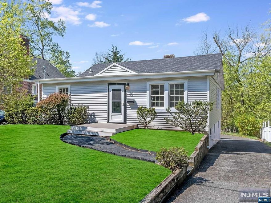 Tastefully updated Bungalow located in the Packanack Lake section of Wayne! Entry foyer leads into the open concept main living area to include living room w/ fireplace, dining room & kitchen. The kitchen features custom cabinetry, Quartz countertops, brand new SS appliances, tile backsplash & bar stool seating. Breakfast nook is located just off of the kitchen & offers sliding glass doors that lead out to the rear deck. The primary bedroom is located off of the entry, offering ample closet space. Beautifully updated full bath features tub shower & storage vanity. There are 2 additional bedrooms located on the opposite side of the foyer. The 2nd floor offers loft space that could be used as a den or an office space. The basement is unfinished but offers laundry & plenty of storage space. It also walks out to the garage & backyard. This home offers brand new central A/C, forced hot air unit, roof, siding, windows, 200 amp service, LED recessed lighting & doors. NOT IN FLOOD ZONE!