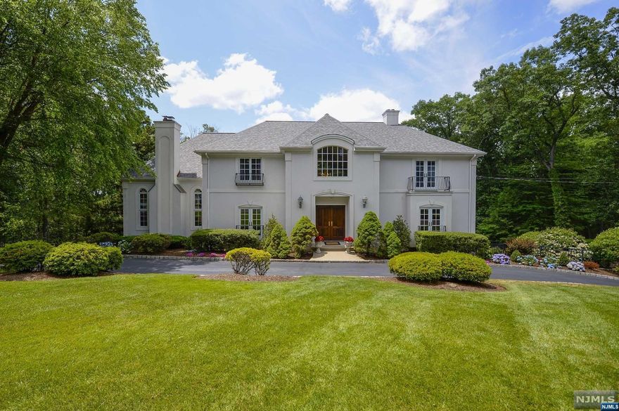 Welcome to this Elegant Brewster Estates home located in #1 ranked town in NJ. This 5 BR, 5.1 BA French inspired Normandy style Home, nestled on 1 ac professionally landscaped property. The 2 story Entry Foyer opens to the Living Rm w/fpl & built in bookcases & a Banquet size Dining Rm. The kitchen features Cherry Cabinetry, Center Island & Counter Tops of Italian granite & Breakfast Area opening to the Scr. Porch. The Great Rm features 19'Tray Ceiling, Raise Paneled Walls, New Wood Flrs, Custom Stone Fpl, floor to ceiling Windows w/breathtaking views of the yard. The Study/Office w/new wood flr & laundry complete this flr. The 2nd flr features a Stunning Primary Suite w/WIC, Fpl, Jac & SS. 2 Add'l BRs w/updated Jack & Jill BA, Another BR & updated Hall BA. The LL features a Fam.Rm w/Kitchenette, BA & BR (Perfect for Guest or Extended Family) & Deck out to a 54'x23' Gunite Pool(designed for lap swimming) Hot Tub, & Blue Stone Patio. Top rated schools & close to NYC transportatio