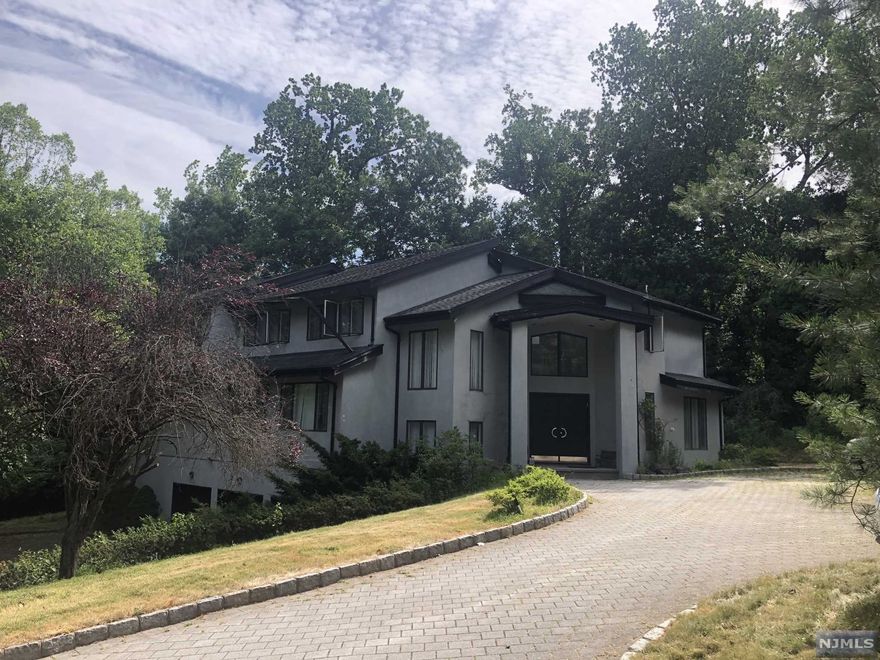 Large Contemporary on spacious corner property w tennis court. Subject needs extensive updating/maintenance. Loads of potential here REO and being sold in strictly as-is condition. Any Cresskill related docs to close are buyer responsibility. Seller will respond to any and all offers after approx 2 weeks listed. "Chase Employees: Please see the Chase Acknowledgement for restrictions"
